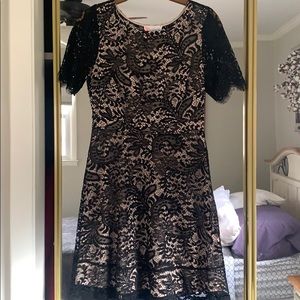 Black laced, cream background mid knee dress